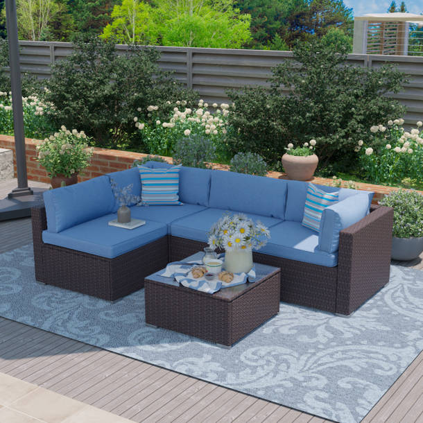 Orren Ellis Ahull 5 Piece Rattan Sectional Seating Group with Cushions